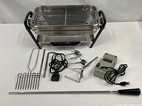 Full set showing broiler base, rack, drip pan, control box, spit rod, forks, skewer rack, support rods