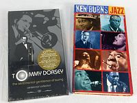 Both CD box sets front covers visible