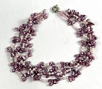 Full view of 4-strand purple and pink freshwater pearl necklace