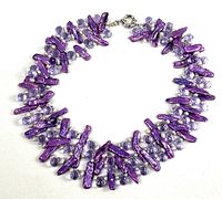Full view of three-strand purple pearl and glass bead necklace