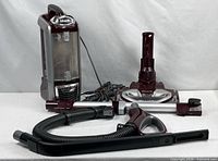 Full view of Shark Rotator TruePet vacuum body, floor nozzle, wand, hose and crevice tool