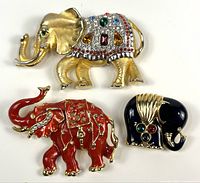 All three elephant brooches grouped