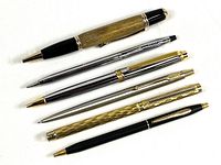 All six pens laid out side by side