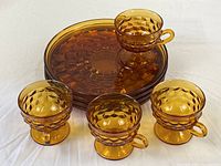 All four plates and cups grouped