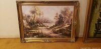 Full view of framed landscape painting front