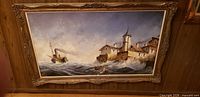 Full view of framed maritime painting showing entire composition and frame