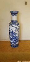 Full frontal view of tall blue and white porcelain vase