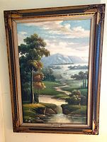 Full view of framed oil landscape painting