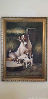 Full view of framed oil painting showing terrier and puppies