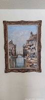 Full view of framed European canal scene print