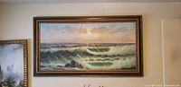 Full view of framed seascape painting on wall