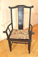 front view of dark-finished Chinese-style armchair