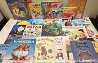Group shot of all 28 children’s books spread out