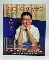 Front cover showing title, author, and image of chef Patricia Yeo