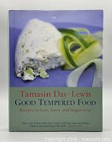 Front cover of cookbook showing title, author and food image