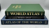 Spine view of three atlas books stacked