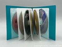 Organizer open displaying multiple discs inside sleeves