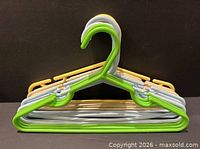 Stacked pastel hangers showing colors and design