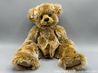 Front view of Heather teddy bear seated
