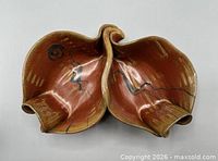 Top view of divided dish showing two lobes and glaze pattern