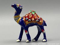 Right side view of blue Meenakari metal camel figurine