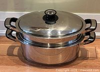 Pot assembled with lid on showing exterior condition