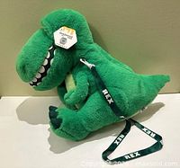 Full view of plush Rex bag showing strap and side profile
