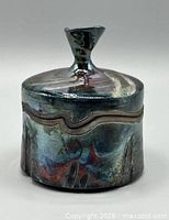 Jar assembled showing glaze, knob, exterior texture