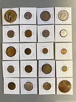 Overall view of all 20 coins in holders