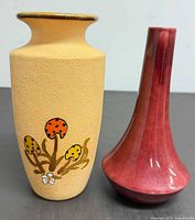 Front view of both vases showing designs and colours