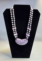 Necklace on display bust showing overall design