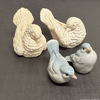 Group shot of all four bird figurines