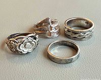 Group shot of four sterling silver rings