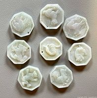 All eight octagonal jadeite pendants laid out