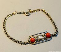 Full view of bracelet showing chain, clasp and decorative panel