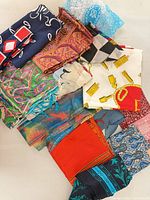 Pile of mixed pattern scarves showing variety