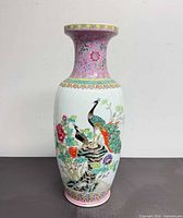 Full view of porcelain vase front showing peacock and floral design