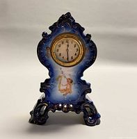 Full front view of cobalt blue porcelain clock