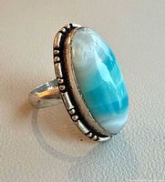 Front view showing larimar cabochon and beaded silver border