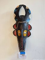 Front view of painted carved wood tribal mask