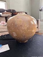 Front view of tan crystalline stoneware vase