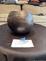 front view of round ceramic gourd pot with dotted motif