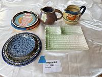 Group shot of all eight ceramic pieces