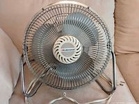 Front view of Lakewood desk fan showing metal guard and blades