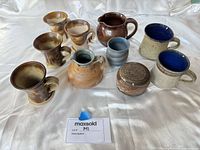 Group shot of all eleven studio pottery pieces