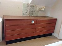 Full view of teak dresser showing overall design and eight-drawer layout