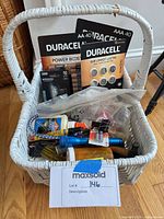 Entire basket with Duracell battery packs, tools visible