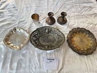 Group shot showing all items in lot: tray, bowl, plate, tumbler, pair candlesticks