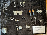 Full lot overview showing all earring pairs and agate pendant necklace