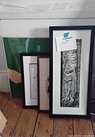 All four framed pieces leaning together for scale